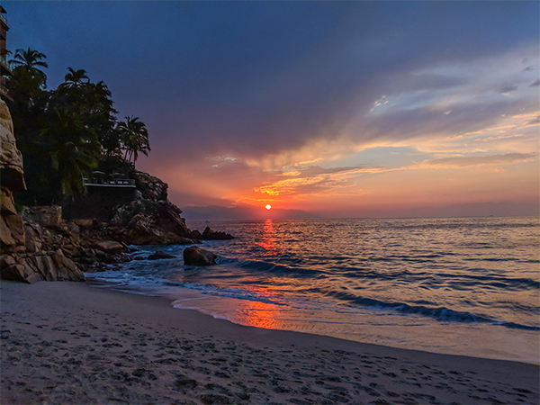 a sunset in Mexico as viewed from a beach