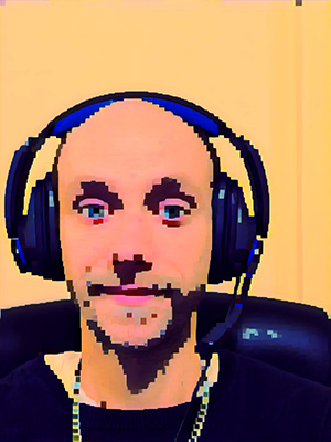 A photo with an 8-bit filter of Scott Demeules with headphones on at his desk.