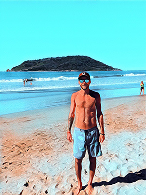 A photo of Scott Demeules showing off his physique at a beach in Mexico, with a slightly cartoonish filter over the photo.
